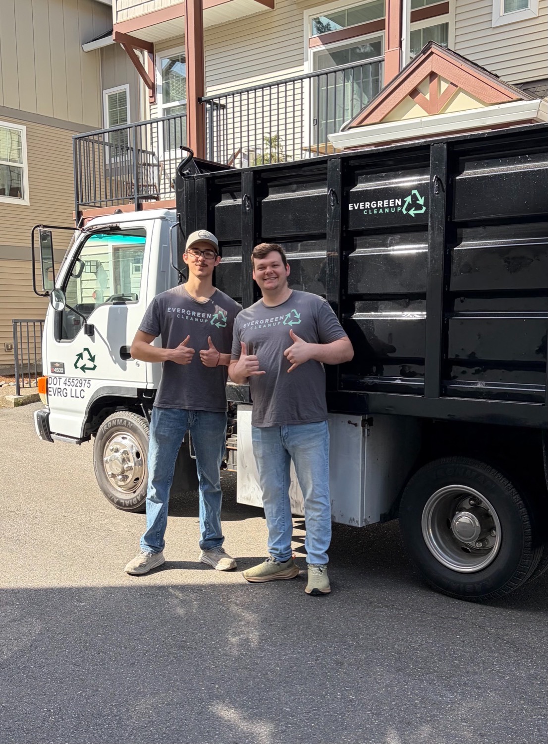 evergreen cleanup crew in front of truck