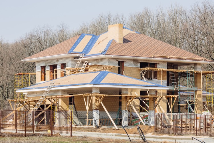 exterior siding and roofing being applied